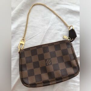 Authentic Louis Vuitton Mini Pochette Accessoires in Damier Ebene